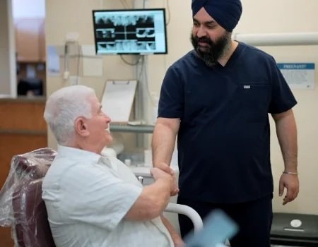 Dentist consulting with patient